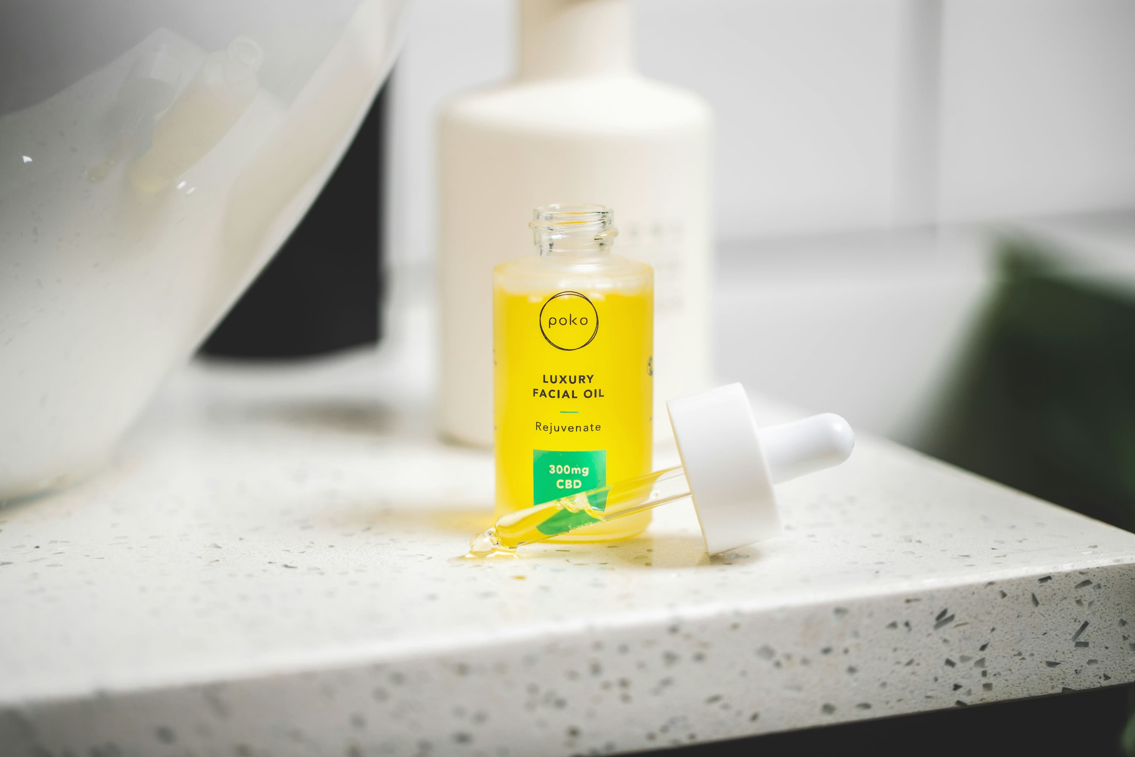 Elegant skincare products arranged on white sink